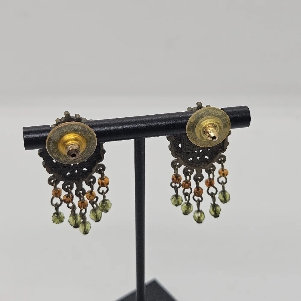 bronze colored earrings with green and orange beading